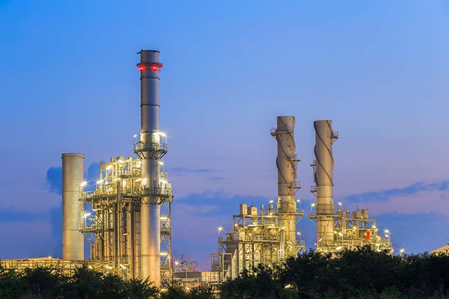 Gas turbine electrical power plant at dusk with twilight support all factory in industrial Estate